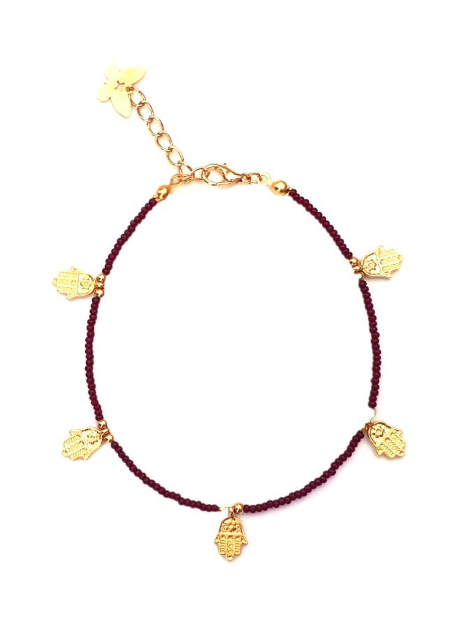 ألوان خلخال مطلي بالذهب مزين بحلية على شكل كف . - Image 1