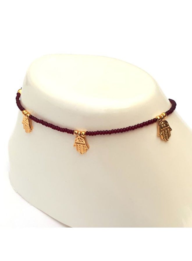 ألوان خلخال مطلي بالذهب مزين بحلية على شكل كف . - Image 2