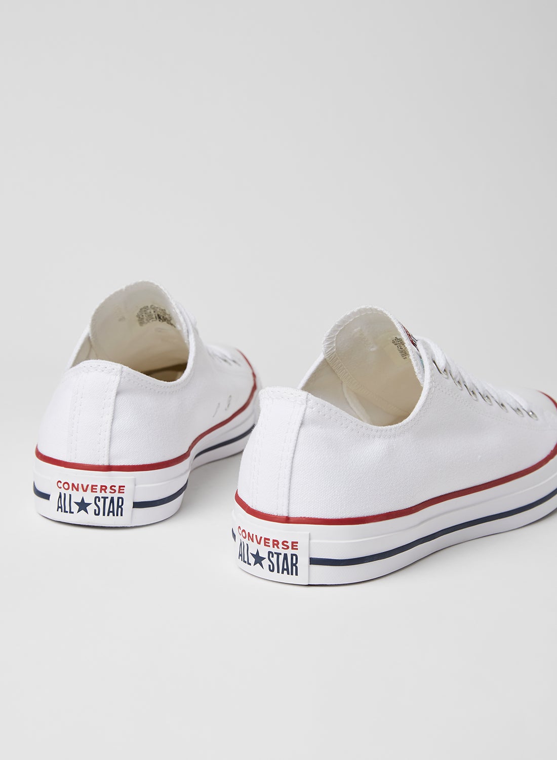 Unisex Chuck Taylor All Star Core OX Sneakers Optical White - https://f.nooncdn.com/p/v1600333211/N13493631V_3.jpg?width=original