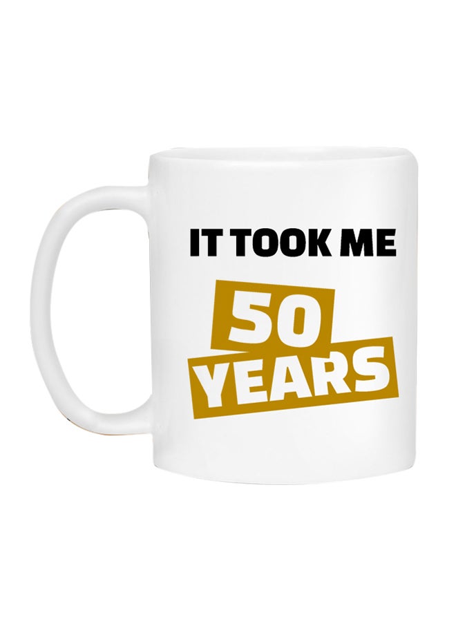 مج قهوة بطبعة عبارة "It Took Me 50 Years" أبيض/أصفر/أسود - Image 1