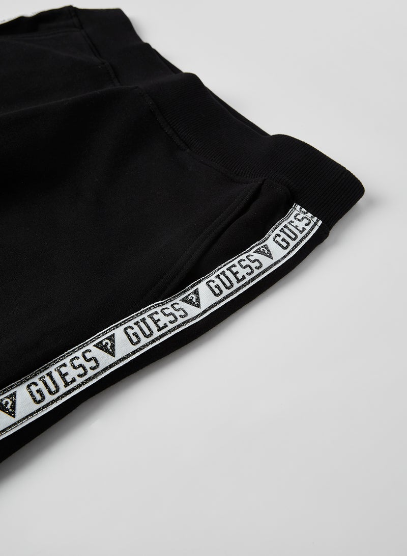 جس بنطال رياضي خفيف للركض بطبعة شعار على الجانبين أسود/ أبيض - Image 3