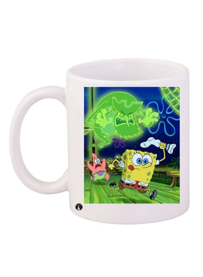 مج قهوة بطبعة من الرسومات الكرتونية "SpongeBob SquarePants" أبيض/أصفر/أخضر