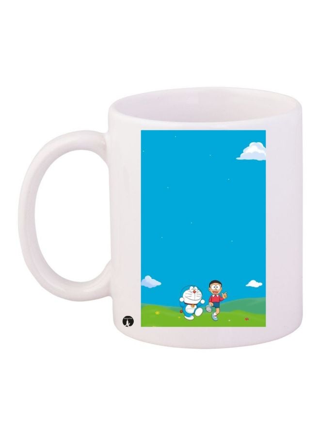 مج قهوة مزين بطبعة شخصية دورايمون أبيض/أزرق/أخضر