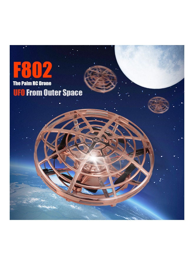 لعبة هدية F802 طائرة درون حجم صغير تعمل بالتحكم اليدوي UFO، وبالأشعة تحت الحمراء، بارتفاع ثابت، مع جهاز تحكم عن بعد، لتدريب المبتدئين على طائرات الكوادركوبتر، بلون ذهبي 14*12*13سم - Image 1