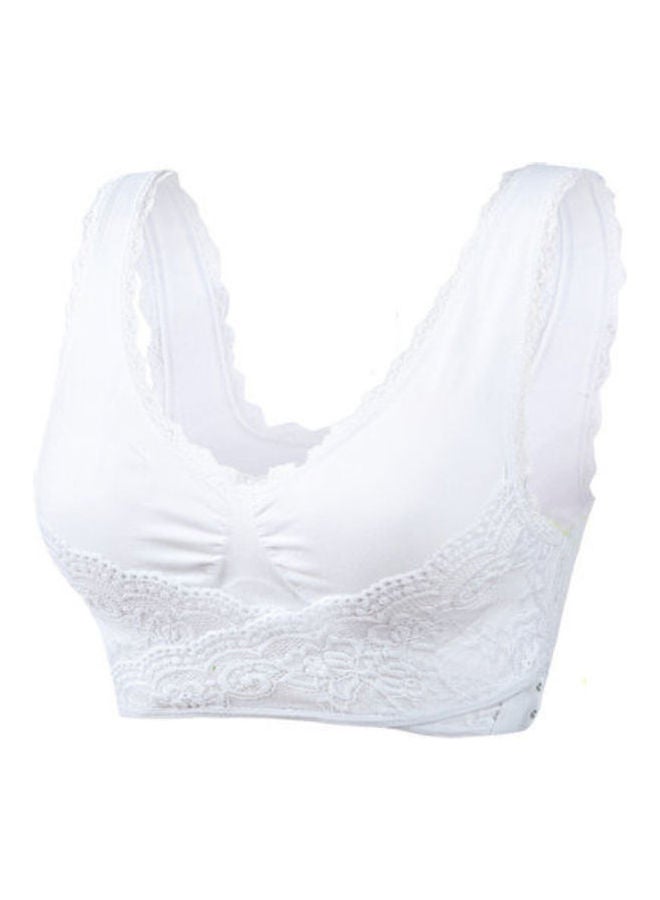 حمالة صدر رياضية جيدة التهوية بنمط متقاطع من الدانتيل أبيض