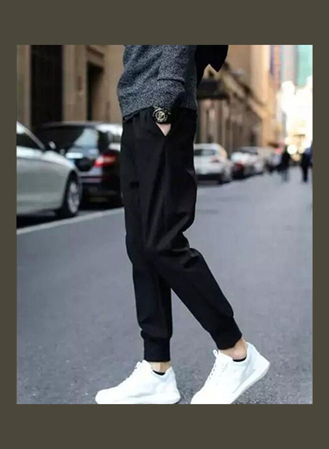 بنطال واسع بقصّة سروال ومربوط من عند الكاحل من مادة سميكة أسود - Image 3