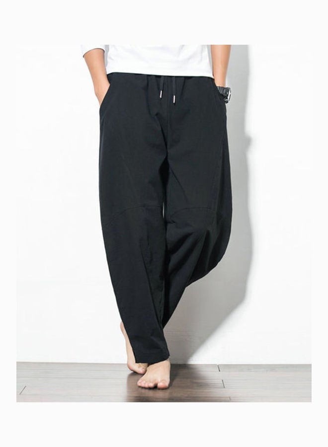 بنطال بأرجل واسعة ولون سادة أسود