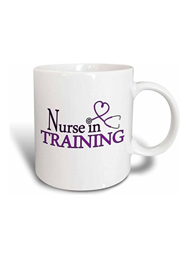 مج من السيراميك مطبوع عليه عبارة Nurse In Training وبه قلب أرجواني متعدد الألوان