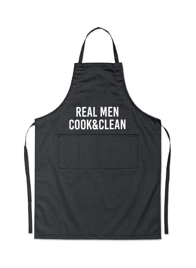 Real Men Cook And Clean Printed Apron Black/White 98x69.5cm  - Image 1