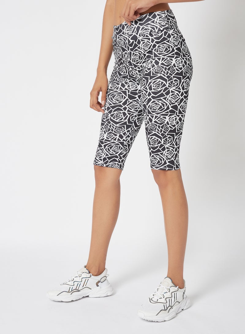 Athletiq - Women's Mid Rise Sports Training Workout Short Knee Length Stretch Leggings With Elastic Waist and All Over Print Black/White - Image 1