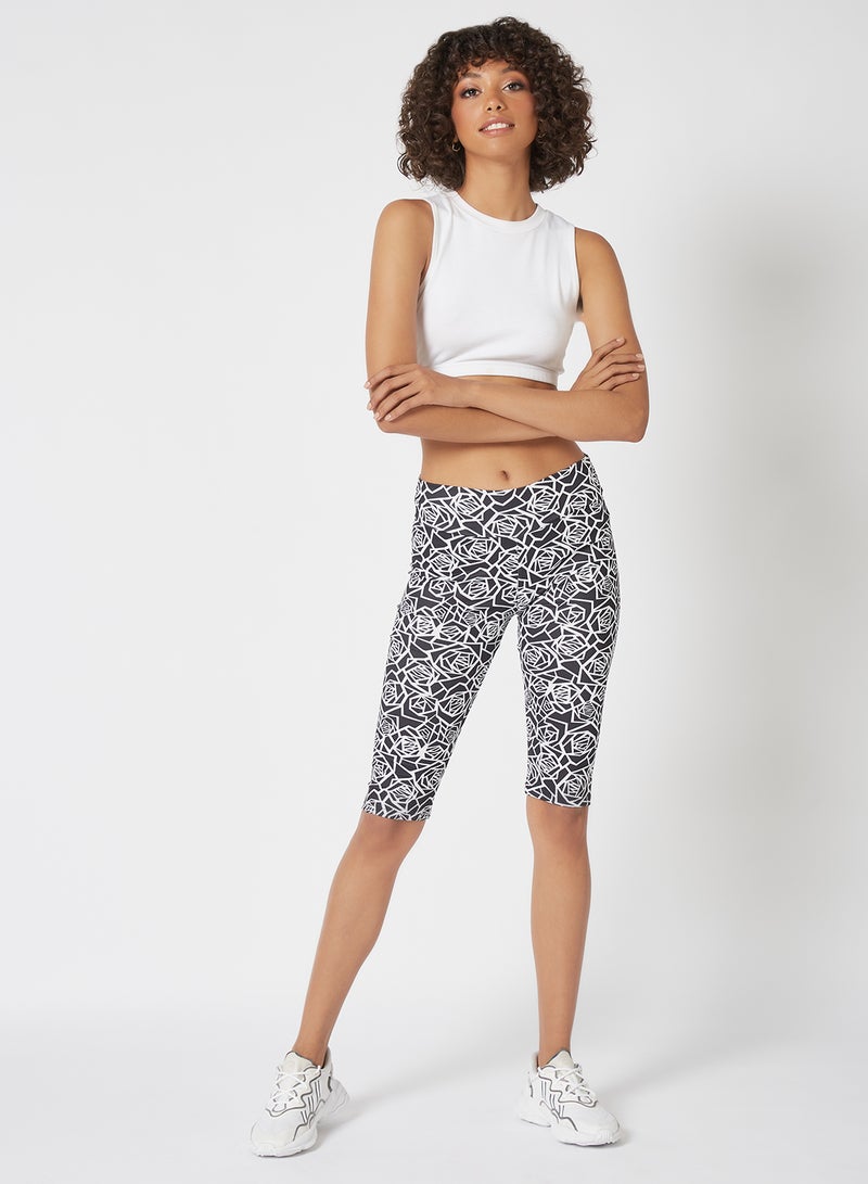 Athletiq - Women's Mid Rise Sports Training Workout Short Knee Length Stretch Leggings With Elastic Waist and All Over Print Black/White - Image 1