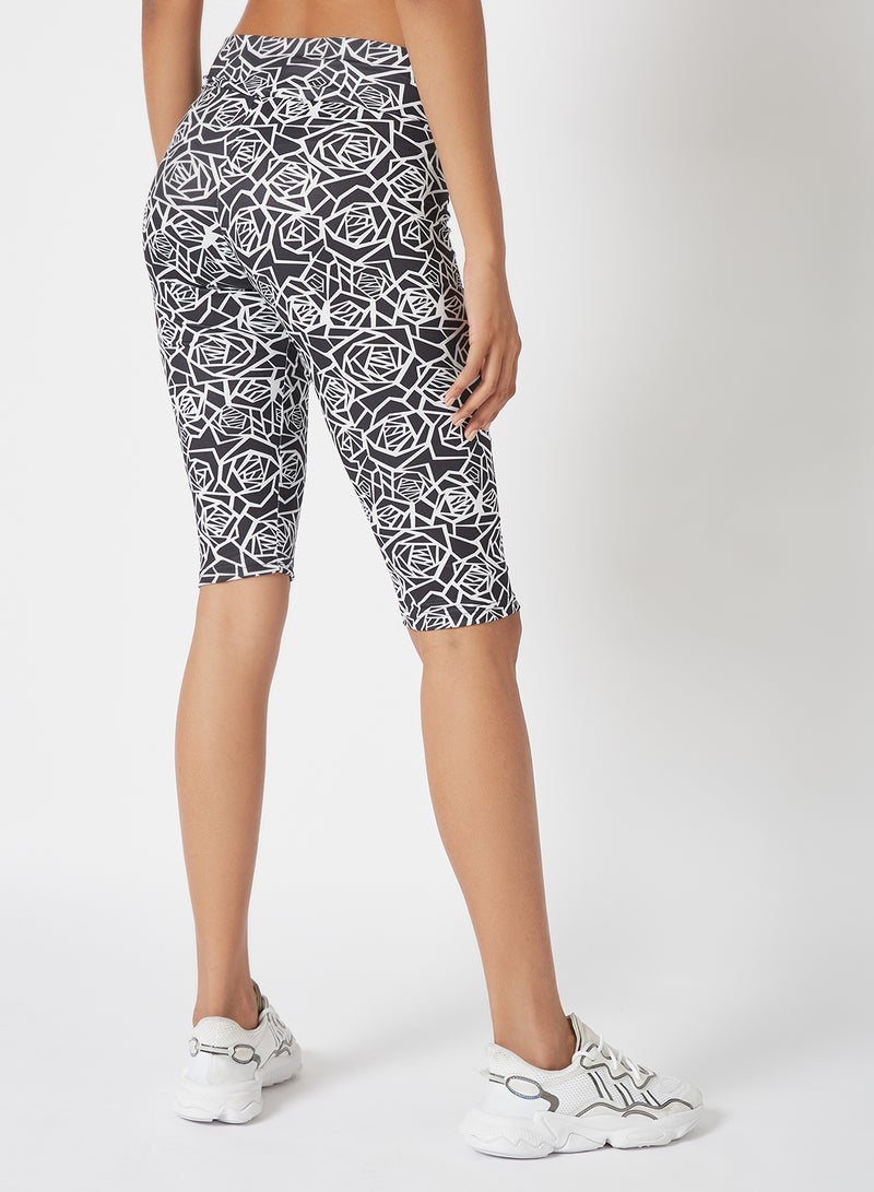 Athletiq - Women's Mid Rise Sports Training Workout Short Knee Length Stretch Leggings With Elastic Waist and All Over Print Black/White - Image 1