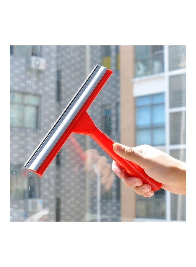 ممسحة لتنظيف زجاج النوافذ. أحمر