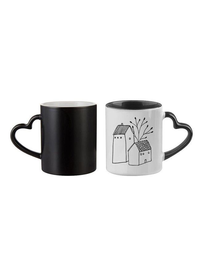 مج سحري مطبوع عليه رسمة منزل أسود