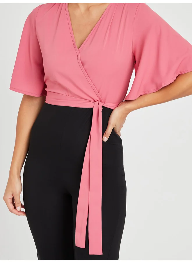 Closet By Styli Tie Belt Detail Colourblocked Flared Sleeve Jumpsuit Pink/Black