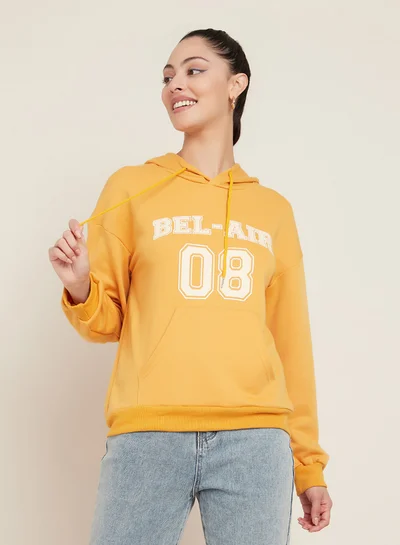 Closet By Styli Bel Air Slogan Print Drop Shoulder Regular Hoodie Mustard
