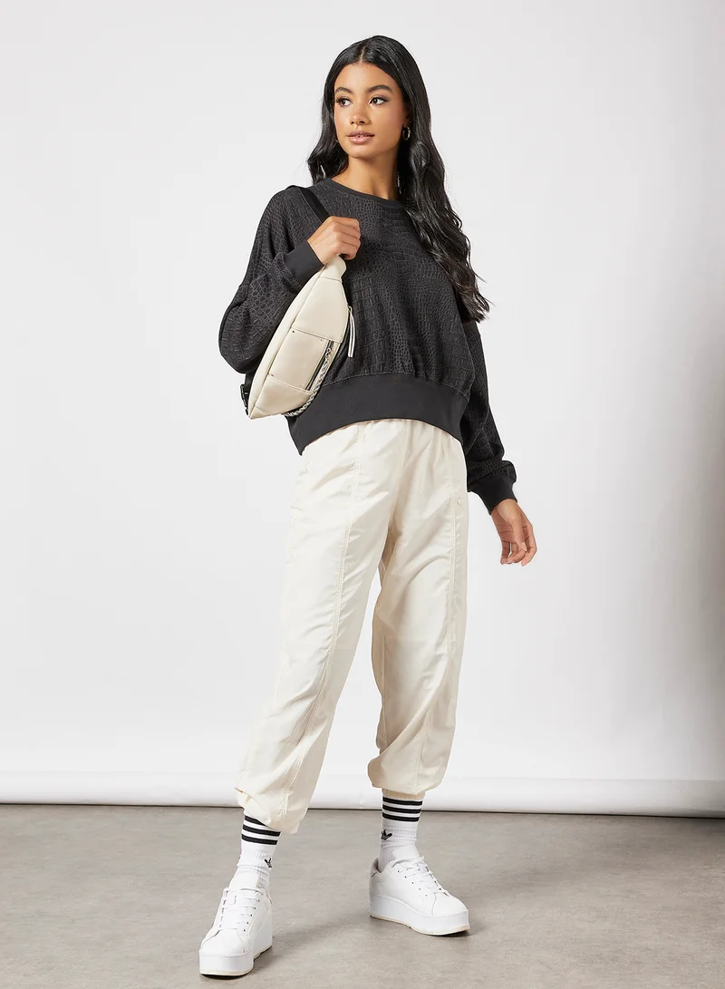 اديداس اوريجينالز Textured Relaxed Fit Sweatshirt