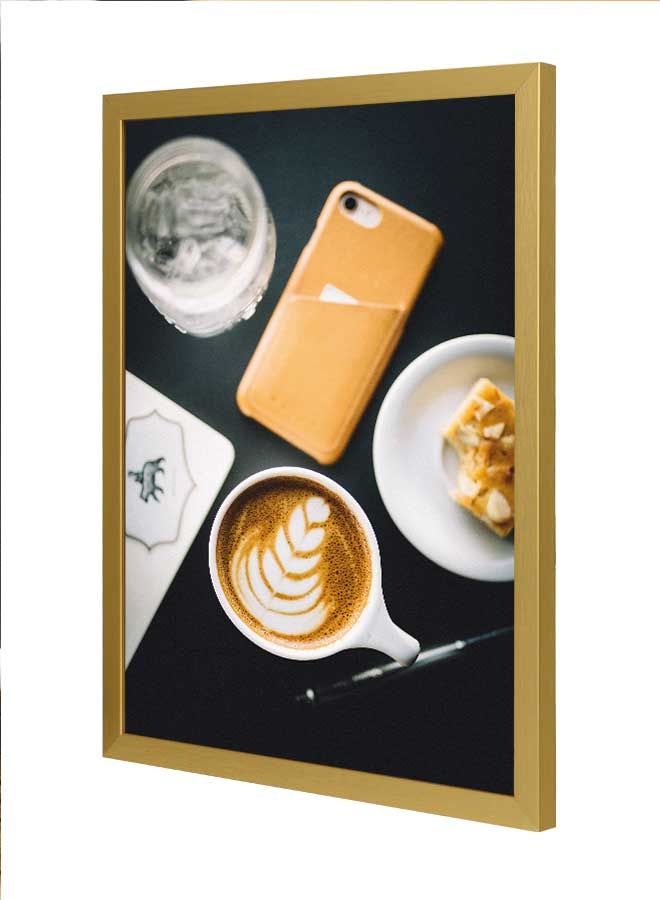 لوحة فنية بإطار لديكور الحائط تعبر عن فنجان من القهوة على الطاولة متعدد الألوان 33x43سم - Image 1