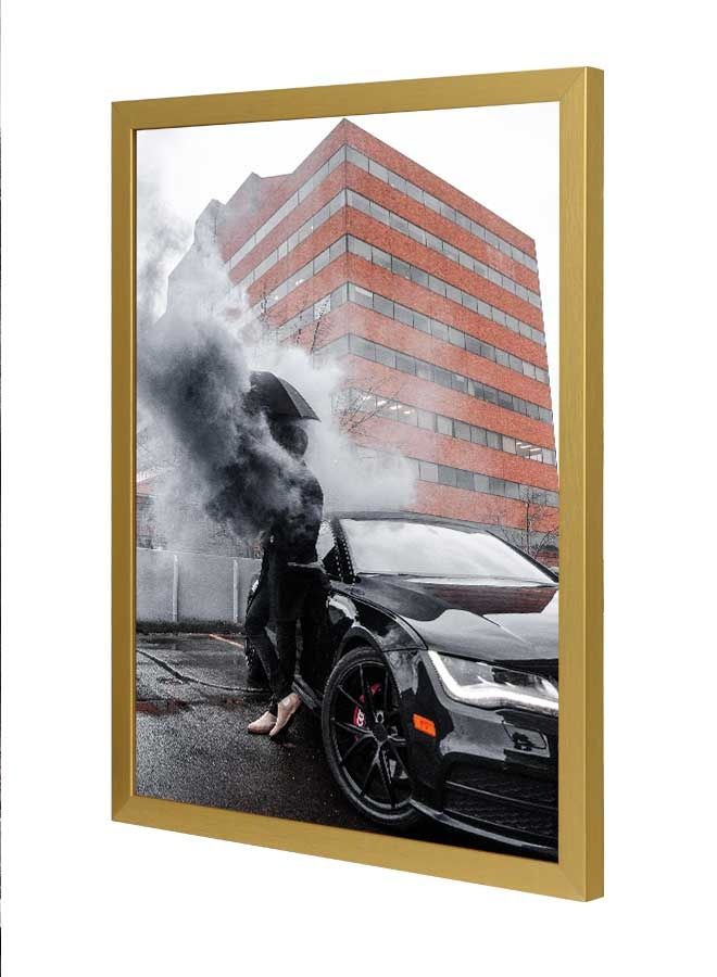 لوحة فنية بإطار لديكور الحائط تُمثل صورة رجل يميل على سيارة متعدد الألوان 33x43سم - Image 1