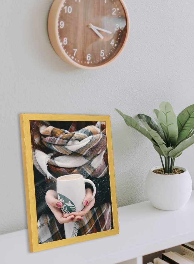 لوحة فنية بإطار لديكور الحائط بتصميم يدين تحملان مج من ستارباكس في البرد أبيض/أخضر/برتقالي 33x43سم - Image 3