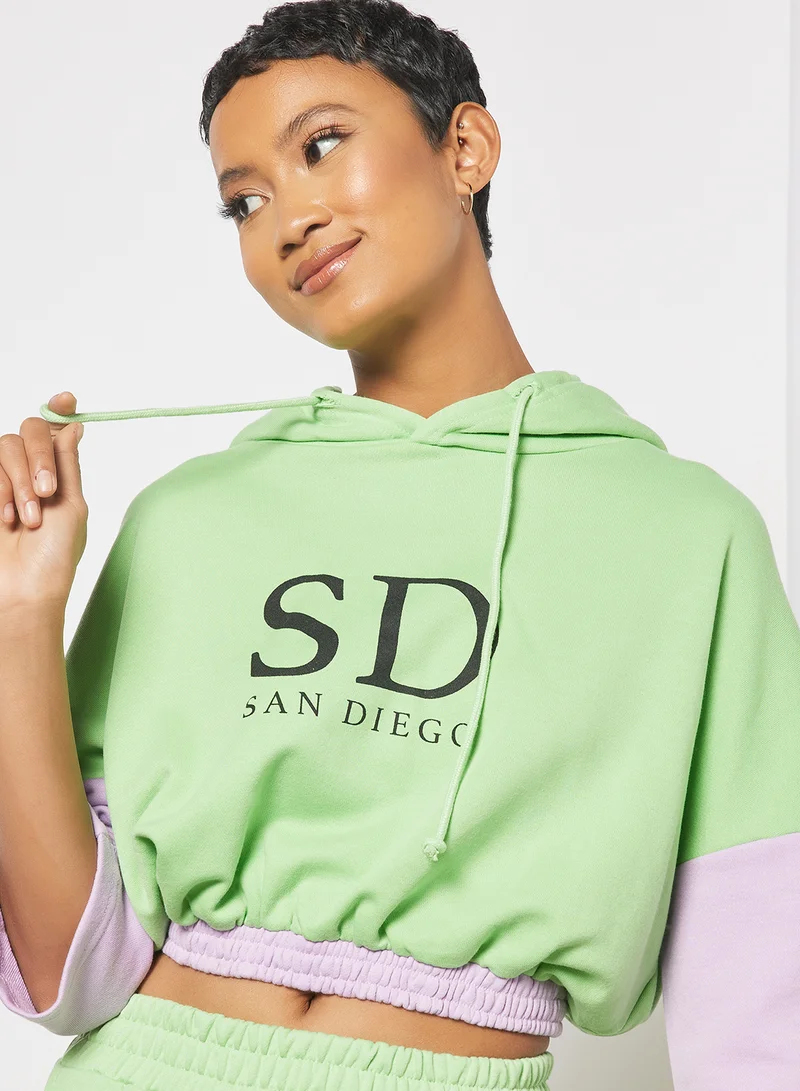 سيفي × جين أم Cropped Colorblock Slogan Hoodie Green/Purple