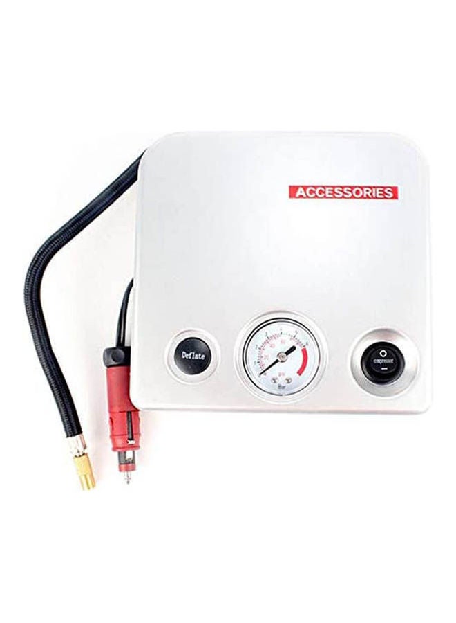 Tire Air Compressor Plugged into Car Lighter