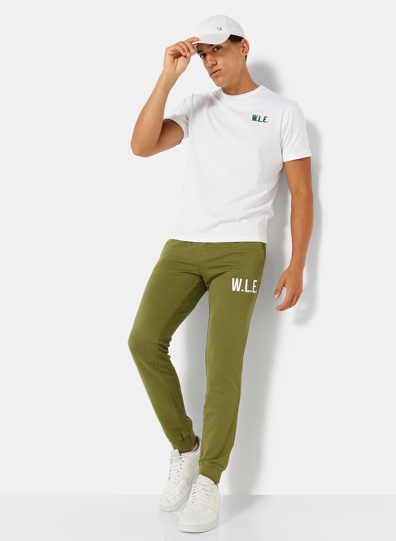 Sivvi x D'Atelier - Eco-Friendly Essential Slogan Sweatpants Olive - Image 1