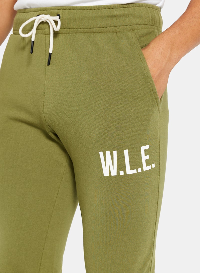 Sivvi x D'Atelier - Eco-Friendly Essential Slogan Sweatpants Olive - Image 1