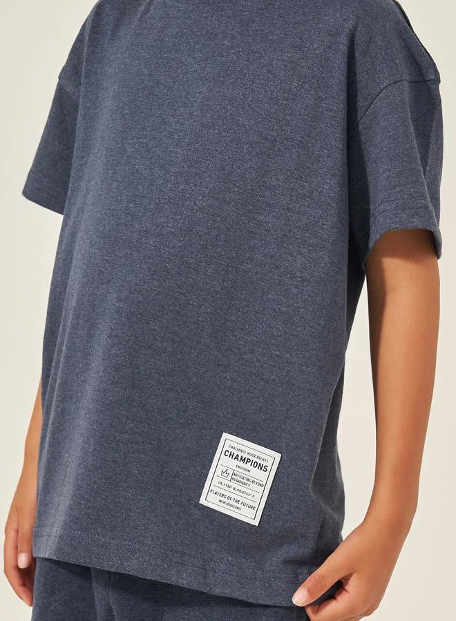 Styli Solid Oversized T-Shirt with Badge Detail