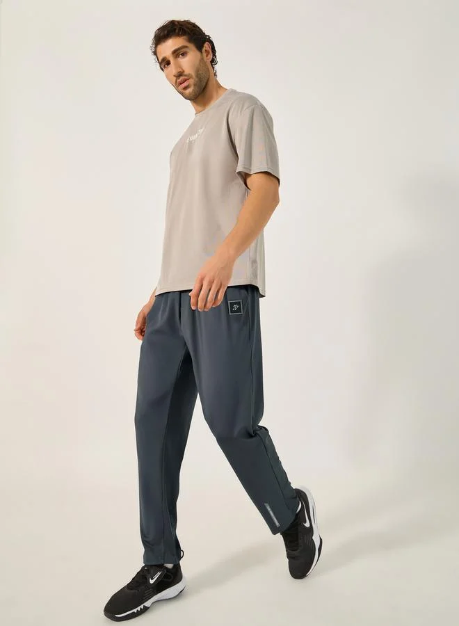 Styli Slim Fit Badge Detail Track Pants with Printed Waistband