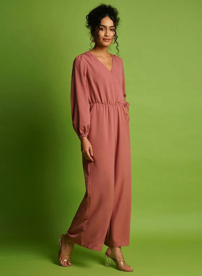 جلو باص Solid Wrap Neck Balloon Sleeves Gathered Waist Jumpsuit by Styli
