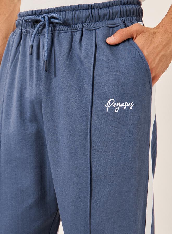 Styli - Oversized Wide Tuck Fleece Joggers with Side Stripe and Print Detail - Image 1