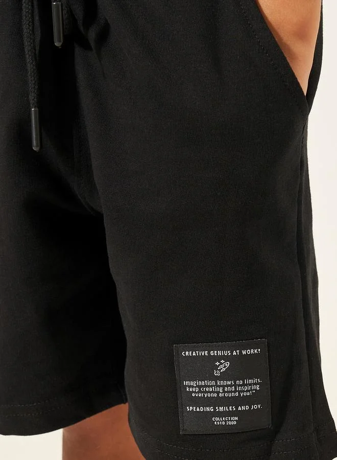 ستايلي Solid Drawstring Shorts with Badge Detail