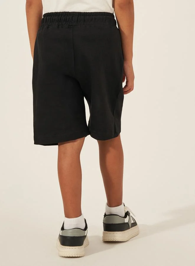ستايلي Solid Drawstring Shorts with Badge Detail