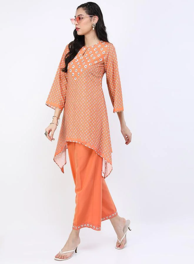 فيشود Women Orange Printed Kurta and Trouser Set by Styli
