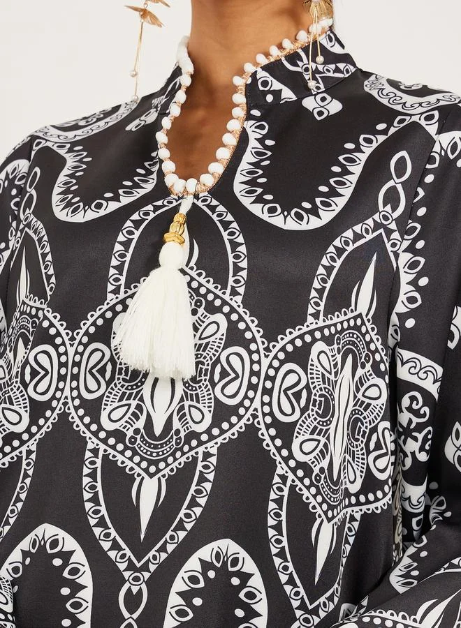 Styli digital print satnd collar jalabiya with lace and tassel trim at neck