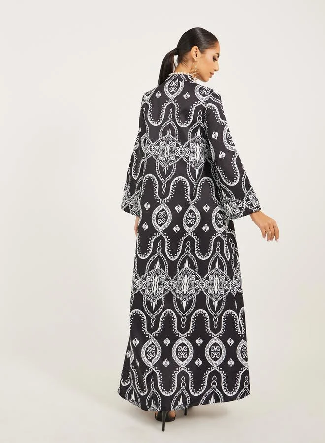 Styli digital print satnd collar jalabiya with lace and tassel trim at neck