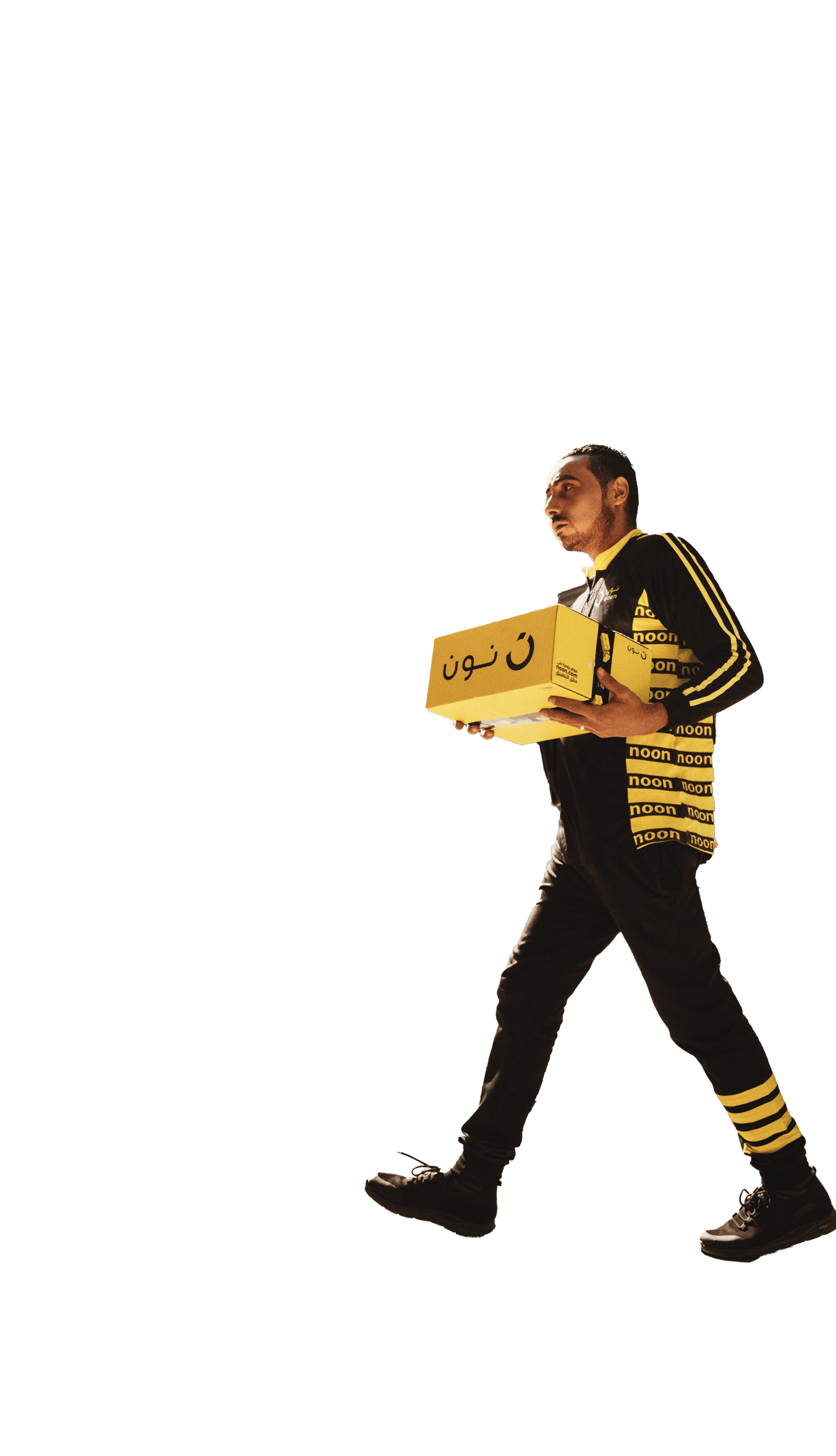A noon delivery agent carrying a box for delivery in Dubai