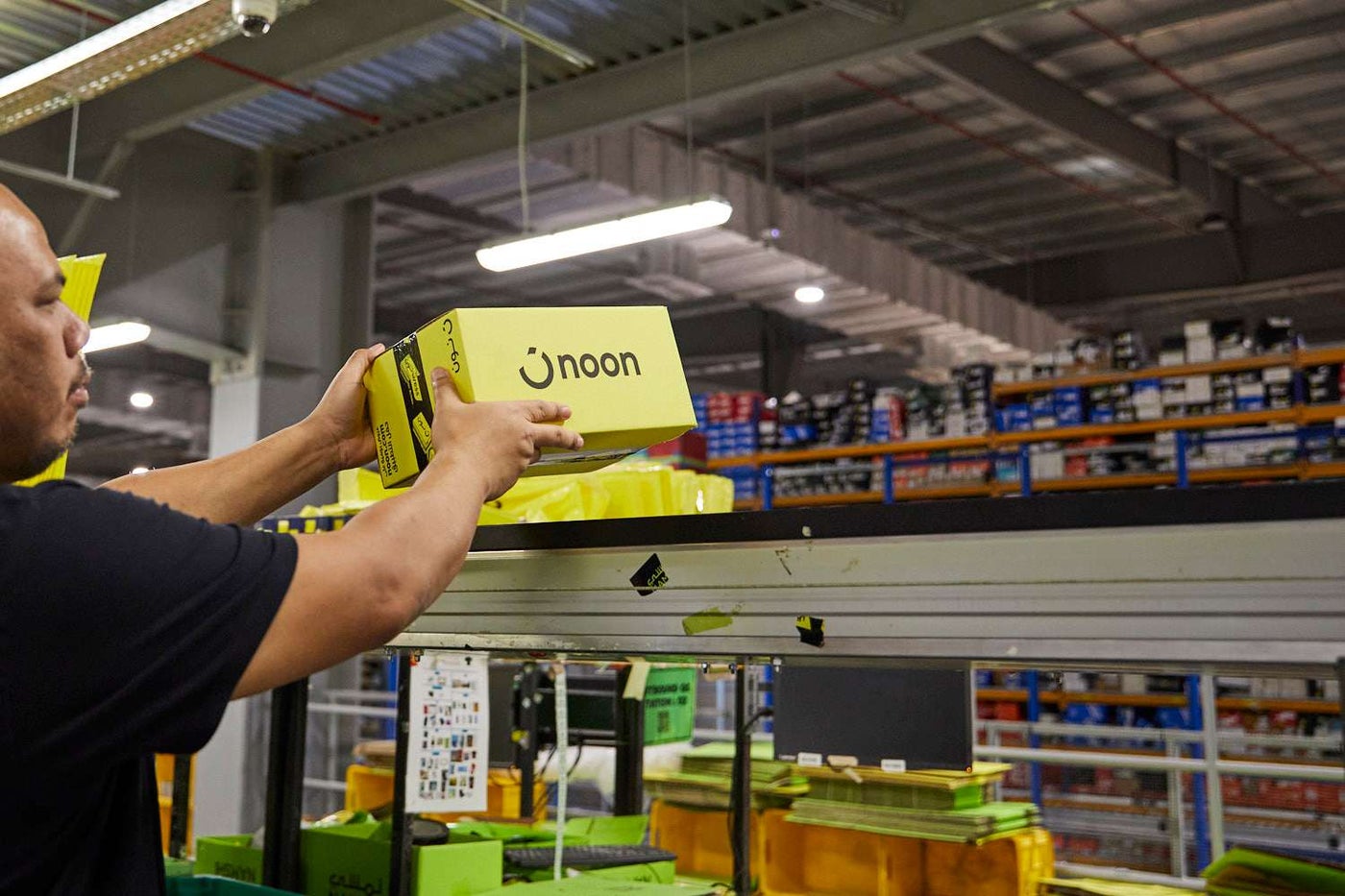 A man holding a box in the warehouse